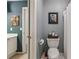 Cozy bathroom features neutral tones, toilet, shower, and framed floral art at 840 Yosemite Dr, Suwanee, GA 30024