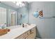 Charming bathroom features vanity with a large mirror and decorative fish art at 840 Yosemite Dr, Suwanee, GA 30024