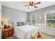 Cozy bedroom with natural light and a comfortable bed, perfect for relaxation at 840 Yosemite Dr, Suwanee, GA 30024
