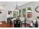 Cozy dining area featuring lots of natural light and hardwood floors at 840 Yosemite Dr, Suwanee, GA 30024