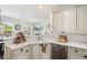 Clean kitchen featuring white cabinets and stainless steel dishwasher at 840 Yosemite Dr, Suwanee, GA 30024