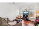 Comfortable living room with hardwood floors, perfect for relaxation and entertainment at 840 Yosemite Dr, Suwanee, GA 30024
