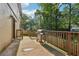 A backyard with a wooden fence and trees with a barbecue grill at 2156 Doris Dr, Decatur, GA 30034