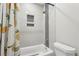 Bathroom featuring a shower-tub combo with a unique tile design at 2156 Doris Dr, Decatur, GA 30034
