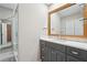 Bathroom with a large mirror, vanity, and walk-in shower at 2156 Doris Dr, Decatur, GA 30034