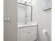 Bathroom with a white vanity, mirror, and decor at 2156 Doris Dr, Decatur, GA 30034