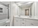 Bathroom with dual sink vanity and shower-tub combo at 2156 Doris Dr, Decatur, GA 30034