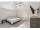 Bedroom with a ceiling fan, TV, and neutral carpeting at 2156 Doris Dr, Decatur, GA 30034