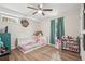 Charming bedroom with wood-look floors, a ceiling fan, and decor at 2156 Doris Dr, Decatur, GA 30034