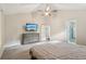 Bedroom with a TV, ceiling fan, and ensuite bath at 2156 Doris Dr, Decatur, GA 30034