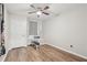 Bedroom with a ceiling fan, wood-look floors, and workout accessories ready for use at 2156 Doris Dr, Decatur, GA 30034