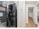 Hallway with laundry closet and a view into a Bedroom at 2156 Doris Dr, Decatur, GA 30034