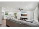 Spacious open concept living room with hardwood floors, a modern ceiling fan, recessed lighting, and seamless kitchen access at 2156 Doris Dr, Decatur, GA 30034