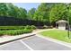 Community entrance with well-manicured landscaping and welcoming signage, enhancing curb appeal at 807 Woodcliff Dr, Sandy Springs, GA 30350