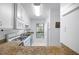 Bright kitchen featuring granite countertops, white appliances, and a view of the outdoors at 807 Woodcliff Dr, Sandy Springs, GA 30350