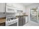 Efficient kitchen featuring granite countertops, and white appliances at 807 Woodcliff Dr, Sandy Springs, GA 30350