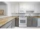 Well-lit kitchen features updated appliances and granite countertops at 807 Woodcliff Dr, Sandy Springs, GA 30350