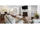 Comfortable living room with dining area featuring hardwood floors, and fireplace at 807 Woodcliff Dr, Sandy Springs, GA 30350