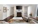 Bright living room featuring a fireplace, hardwood floors, and natural light at 807 Woodcliff Dr, Sandy Springs, GA 30350