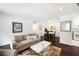 Spacious living room featuring hardwood floors, natural light, and access to the kitchen at 807 Woodcliff Dr, Sandy Springs, GA 30350