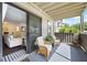 Inviting covered patio with wicker seating and seamless indoor-outdoor flow, perfect for entertaining at 807 Woodcliff Dr, Sandy Springs, GA 30350