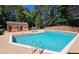 Community pool with ample lounge chairs, offering a resort-style experience in a lush setting at 807 Woodcliff Dr, Sandy Springs, GA 30350
