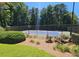 Community tennis court surrounded by lush landscaping, offering a serene recreational space at 807 Woodcliff Dr, Sandy Springs, GA 30350