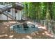 Cozy backyard fire pit area with seating, perfect for outdoor entertaining with stone accents at 1810 Fairoaks Pl, Decatur, GA 30033