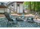 Backyard patio with outdoor seating around a modern fire pit, ideal for relaxing with friends and Gathering at 1810 Fairoaks Pl, Decatur, GA 30033