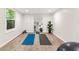 Bright basement area featuring light wood floors and fitness accessories at 1810 Fairoaks Pl, Decatur, GA 30033
