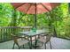 Deck area featuring an umbrella and a table with seating for four at 1810 Fairoaks Pl, Decatur, GA 30033