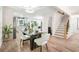 Open-concept kitchen and dining area with hardwood floors and stairs to the upper level at 1810 Fairoaks Pl, Decatur, GA 30033
