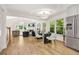 This dining area features wood floors, lots of light, modern light fixture and stainless steel appliances at 1810 Fairoaks Pl, Decatur, GA 30033