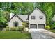 Charming two-story home with a landscaped front yard and a two-car garage at 1810 Fairoaks Pl, Decatur, GA 30033