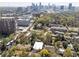Breathtaking aerial view featuring the property, city skyline, and surrounding lush greenery, highlighting the location at 1821 Huntington Hills Nw Ln, Atlanta, GA 30309