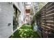 Small, private backyard with artificial turf and a modern horizontal fence at 1821 Huntington Hills Nw Ln, Atlanta, GA 30309