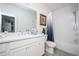 Well-lit bathroom features a combined tub and shower with white cabinets and decor at 1821 Huntington Hills Nw Ln, Atlanta, GA 30309