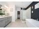 Modern bathroom features a walk-in shower, garden tub, dual sink vanity, and a walk-in closet at 1821 Huntington Hills Nw Ln, Atlanta, GA 30309