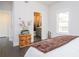 Bright bedroom with hardwood floors, ensuite bathroom, and large window at 1821 Huntington Hills Nw Ln, Atlanta, GA 30309