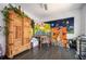 Bonus room featuring hardwood floors, a wooden wardrobe, and multiple artworks for a creative space at 1821 Huntington Hills Nw Ln, Atlanta, GA 30309