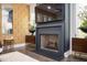Living room fireplace featuring modern design, sleek decor, mounted television, and patterned wallpaper at 1821 Huntington Hills Nw Ln, Atlanta, GA 30309