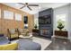 Cozy living room fireplace with mounted television, patterned wallpaper, and contemporary decor at 1821 Huntington Hills Nw Ln, Atlanta, GA 30309