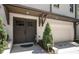 Inviting front entrance featuring double doors, stylish brickwork, and a convenient attached garage at 1821 Huntington Hills Nw Ln, Atlanta, GA 30309