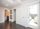 Bright hallway with access to a bathroom, closet, and a porch with outdoor seating at 1821 Huntington Hills Nw Ln, Atlanta, GA 30309
