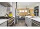 Open-concept kitchen with stainless steel appliances and seamless flow to living area at 1821 Huntington Hills Nw Ln, Atlanta, GA 30309
