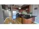 Cozy kitchen with stainless steel appliances, dark wood cabinetry, and granite countertops at 20 Marietta Nw St # 16A, Atlanta, GA 30303