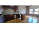 Open-concept kitchen with a washer/dryer combo, stainless steel appliances and hardwood floors at 20 Marietta Nw St # 16A, Atlanta, GA 30303