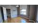 Hardwood-floored room featuring an open doorway and an outside view through a window at 20 Marietta Nw St # 16A, Atlanta, GA 30303