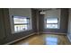 Spacious living space featuring large windows and hardwood floors, providing plenty of natural light at 20 Marietta Nw St # 16A, Atlanta, GA 30303