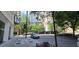 Street view of the building near a bustling cityscape, showing street parking, and adjacent sidewalks at 20 Marietta Nw St # 16A, Atlanta, GA 30303